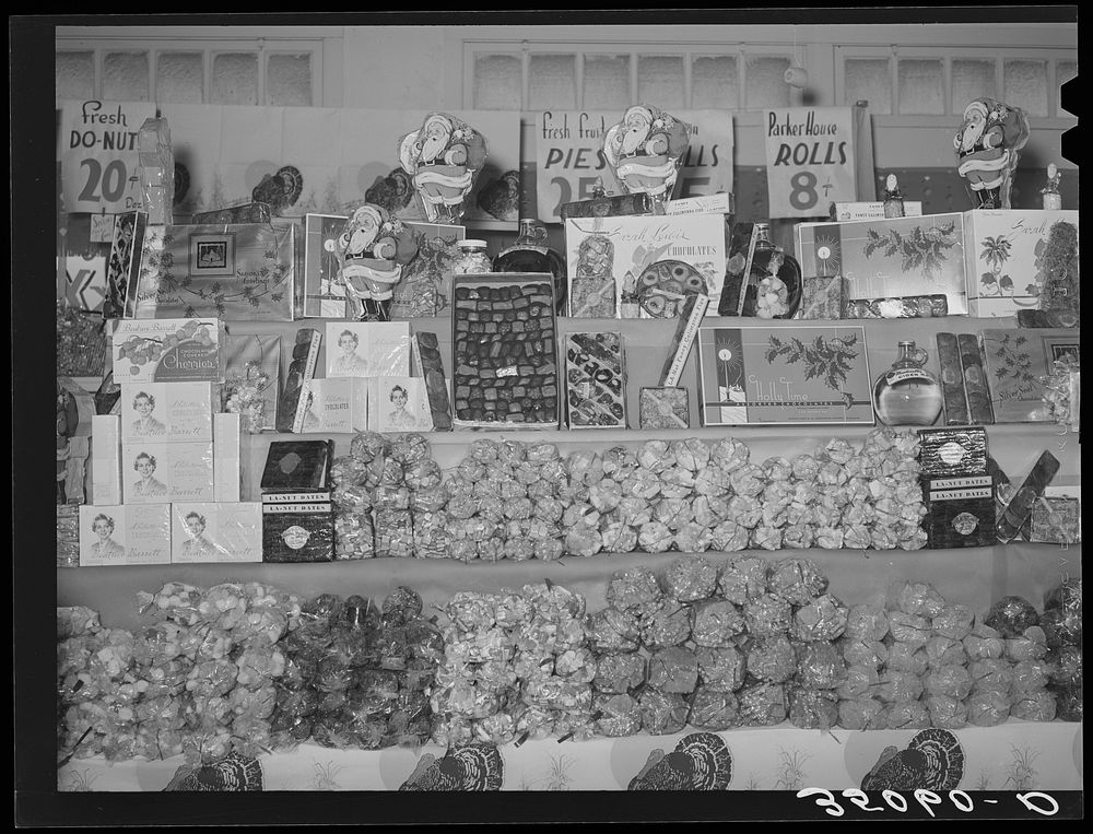 Display of candy and fruits at retail grocery. San Angelo, Texas by Russell Lee