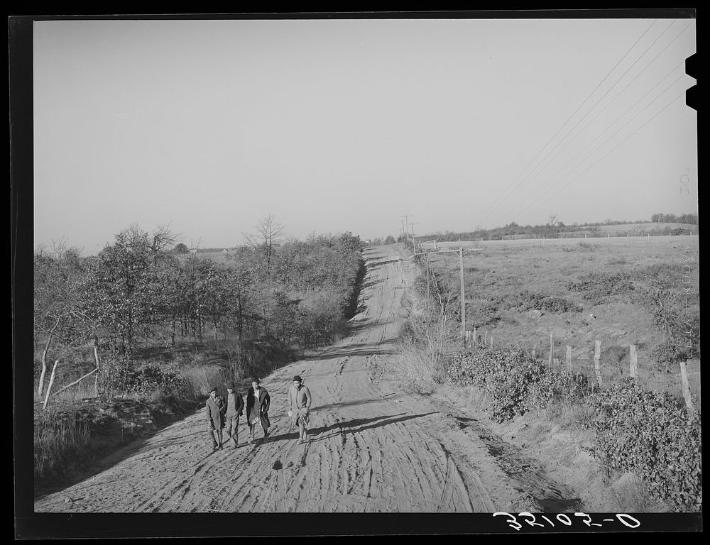 Children of Pomp Hall,  tenant farmer, climbing hill on country road on their way to school. Creek County, Oklahoma. See…
