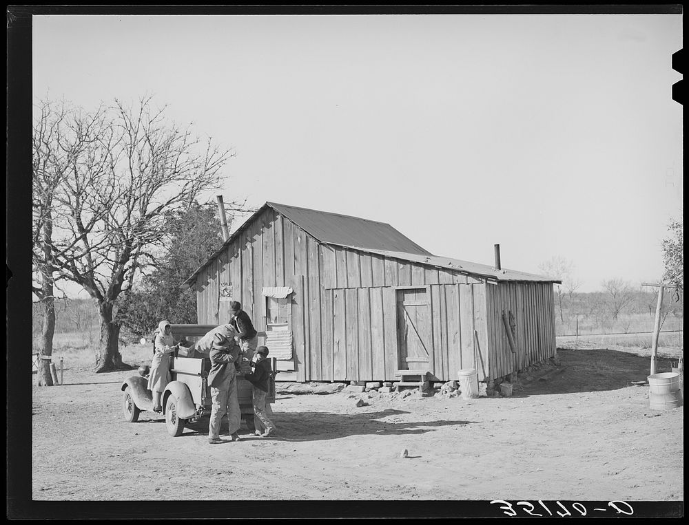 Pomp Hall, his wife and children unloading truck after a trip to town. Creek County, Oklahoma. See general caption number 23…