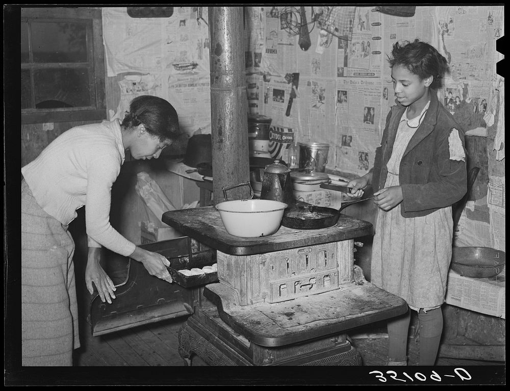 Preparing breakfast in home of Pomp Hall,  tenant farmer. Creek County, Oklahoma. See general caption number 23 by Russell…