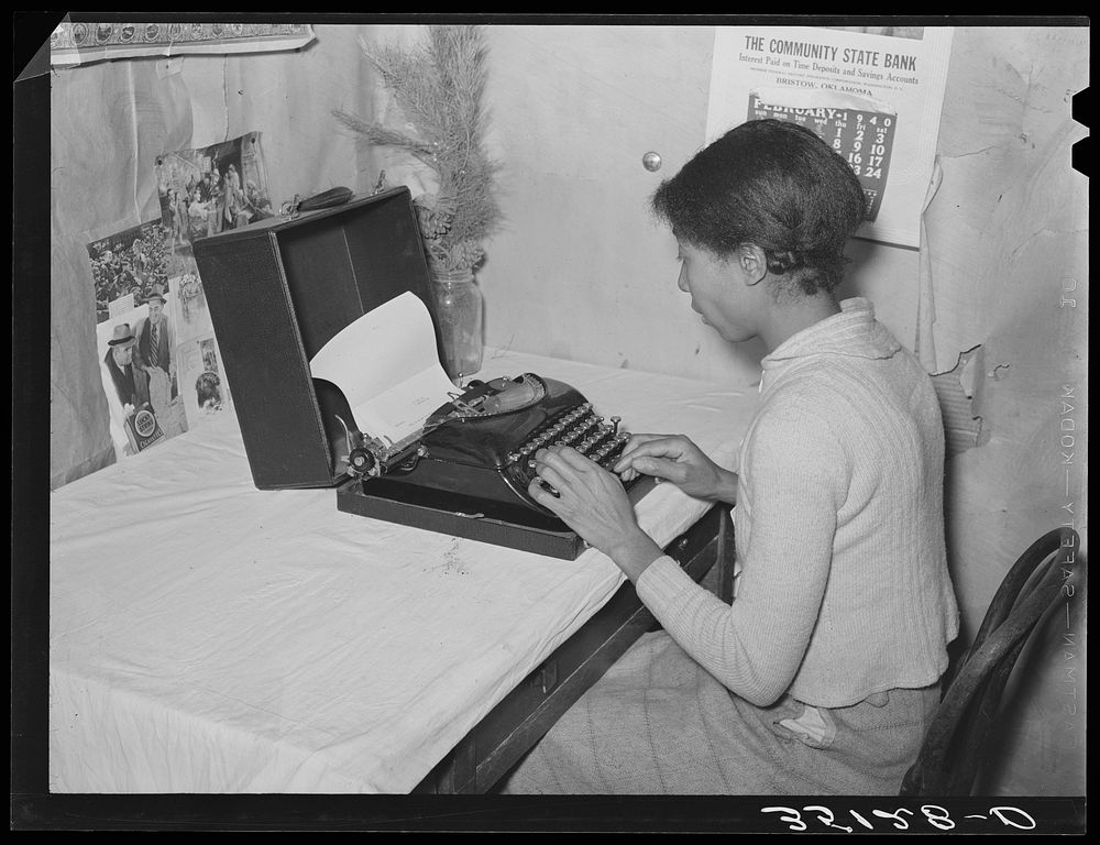 Wife of Pomp Hall,  tenant farmer, writing on typewriter. Through union activities this family has developed a desire for…