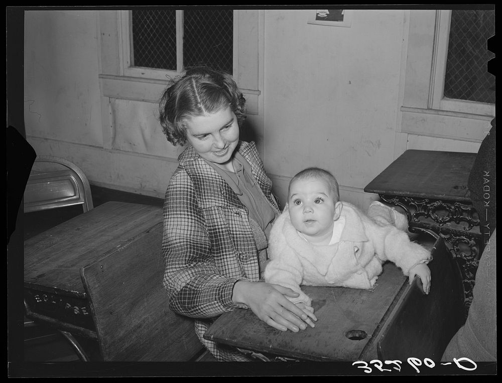 Mother and child at pie supper in Muskogee County, Oklahoma. See general caption number 24 by Russell Lee