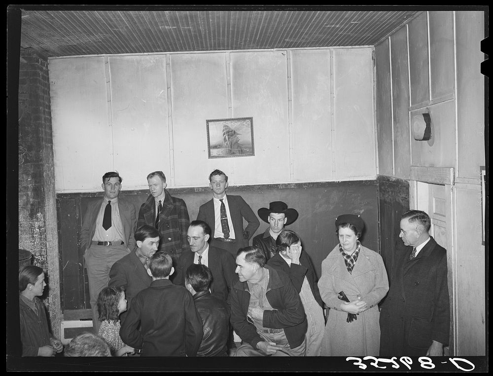 [Untitled photo, possibly related to: Auctioning off the pies at pie supper in the school house. Muskogee County, Oklahoma.…