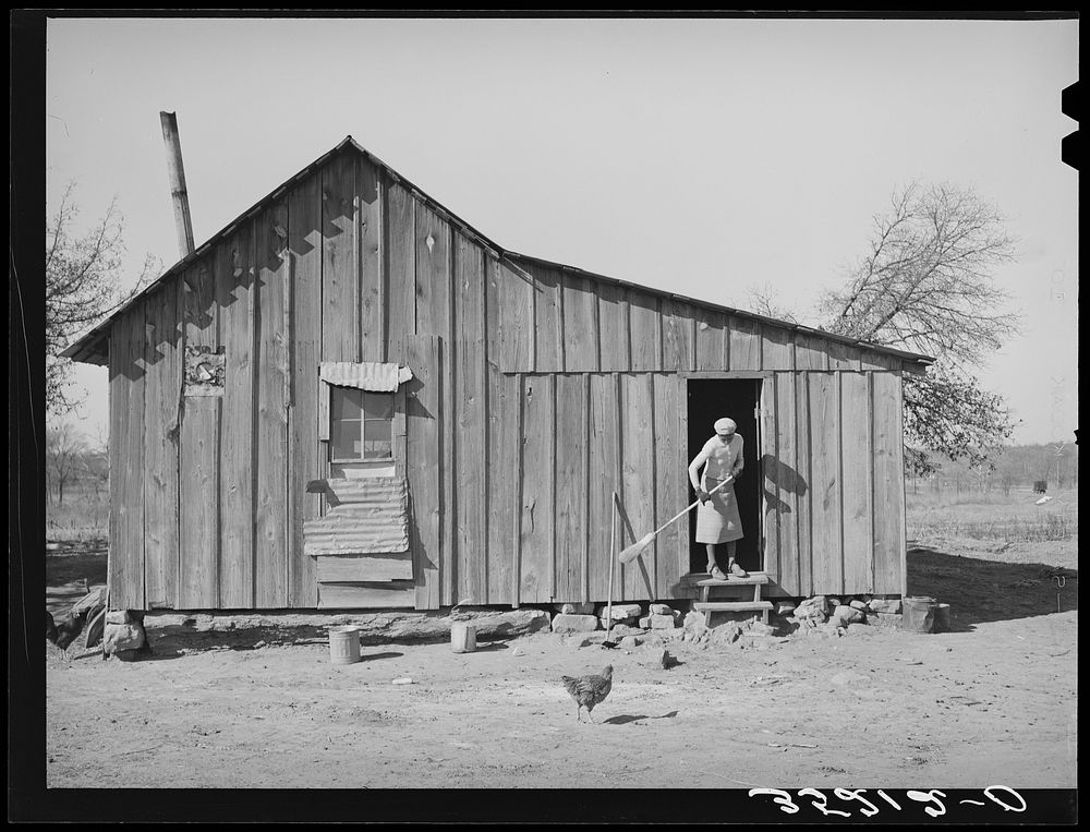 Wife of Pomp Hall, tenant farmer, sweeping off the kitchen steps. Creek County, Oklahoma. See general caption number 23 by…