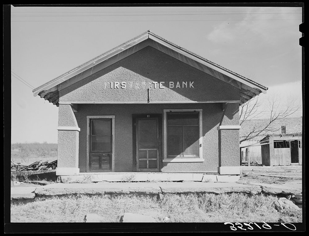 Deserted bank building in the oil ghost town of Slick, Oklahoma by Russell Lee