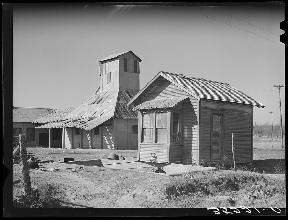Cotton gin in the oil ghost town of Slick, Oklahoma by Russell Lee