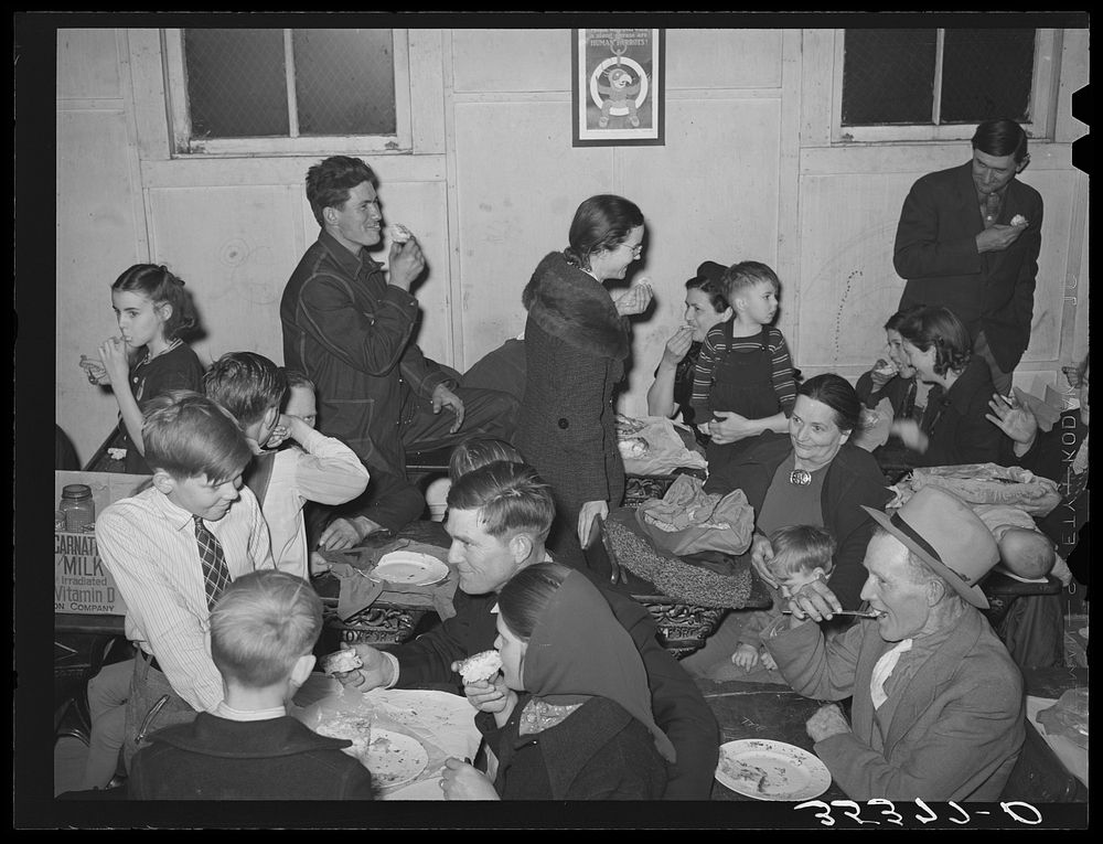 Eating pie at pie supper in Muskogee County, Oklahoma. See general caption number 24 by Russell Lee
