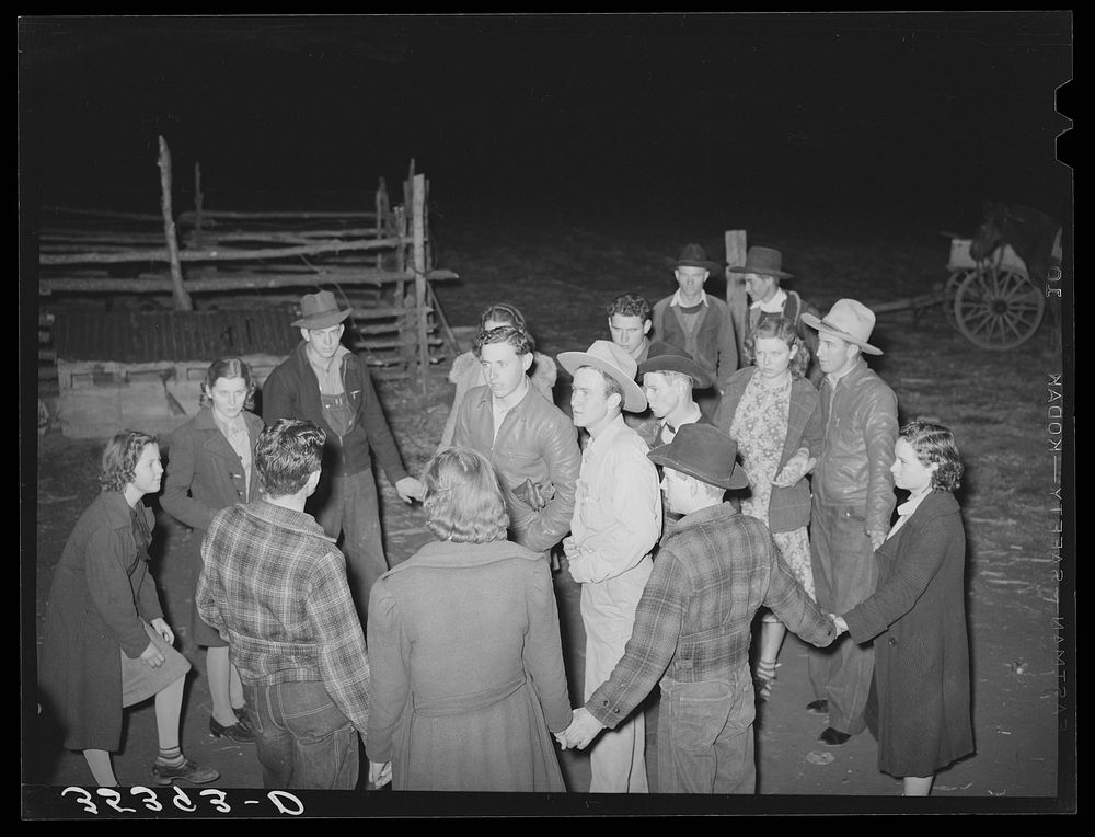 Boys and girls deciding what game to play next at play party in McIntosh County, Oklahoma. See general caption number 26 by…