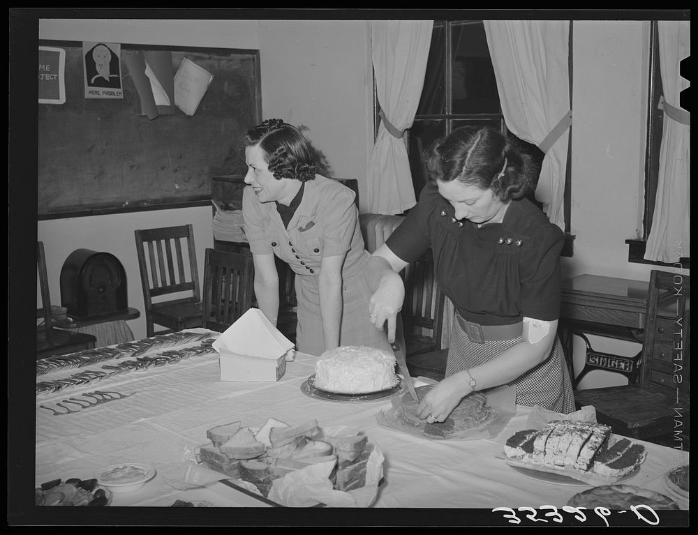 Wife of Jaycee member cutting cake at buffet supper at the high school. Eufaula, Oklahoma. See general caption number 25 by…