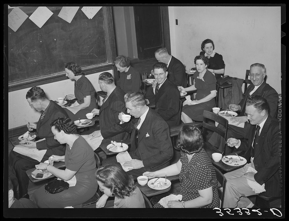Jaycee members and their wives eating in room of high school where they had a buffet supper. Eufaula, Oklahoma. See general…