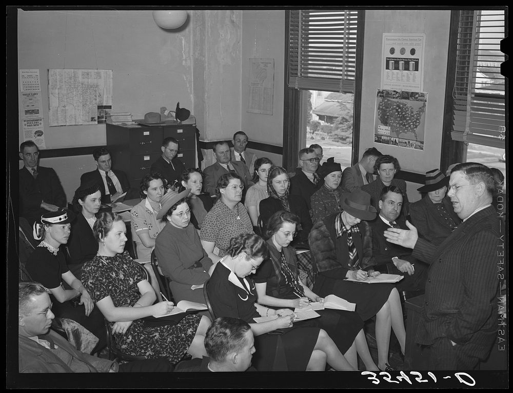 Regional FSA (Farm Security Administration) official talking to FSA officials and supervisors at a district meeting. San…