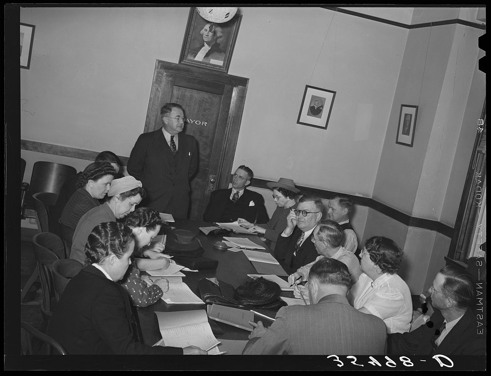 FSA (Farm Security Administration) regional official talking to a group of FSA officials and supervisors at a district…