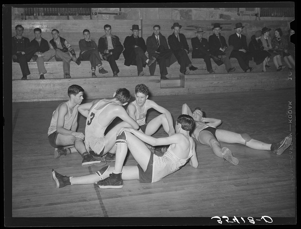 Basketball players resting between periods. Eufaula, Oklahoma by Russell Lee