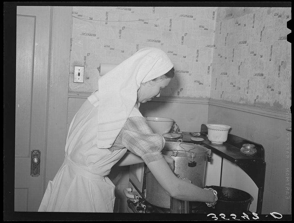 [Untitled photo, possibly related to: FSA (Farm Security Administration) supervisor demonstrating canning with a pressure…