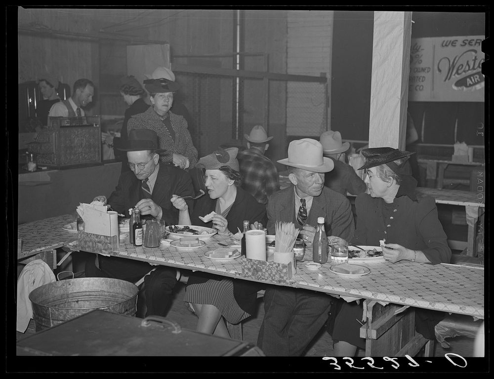 Cattlemen and their wives eating at a restaurant on the grounds of the San Angelo Fat Stock Show. San Angelo, Texas by…