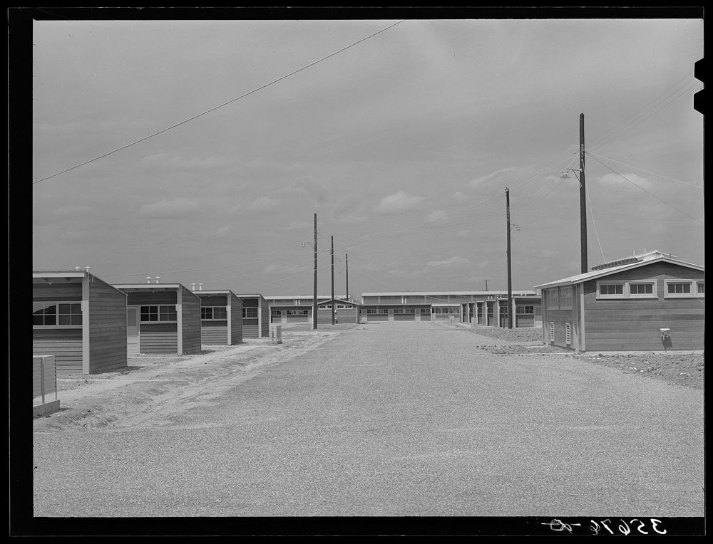 One of the main streets of the migratory labor camp at Sinton, Texas by Russell Lee