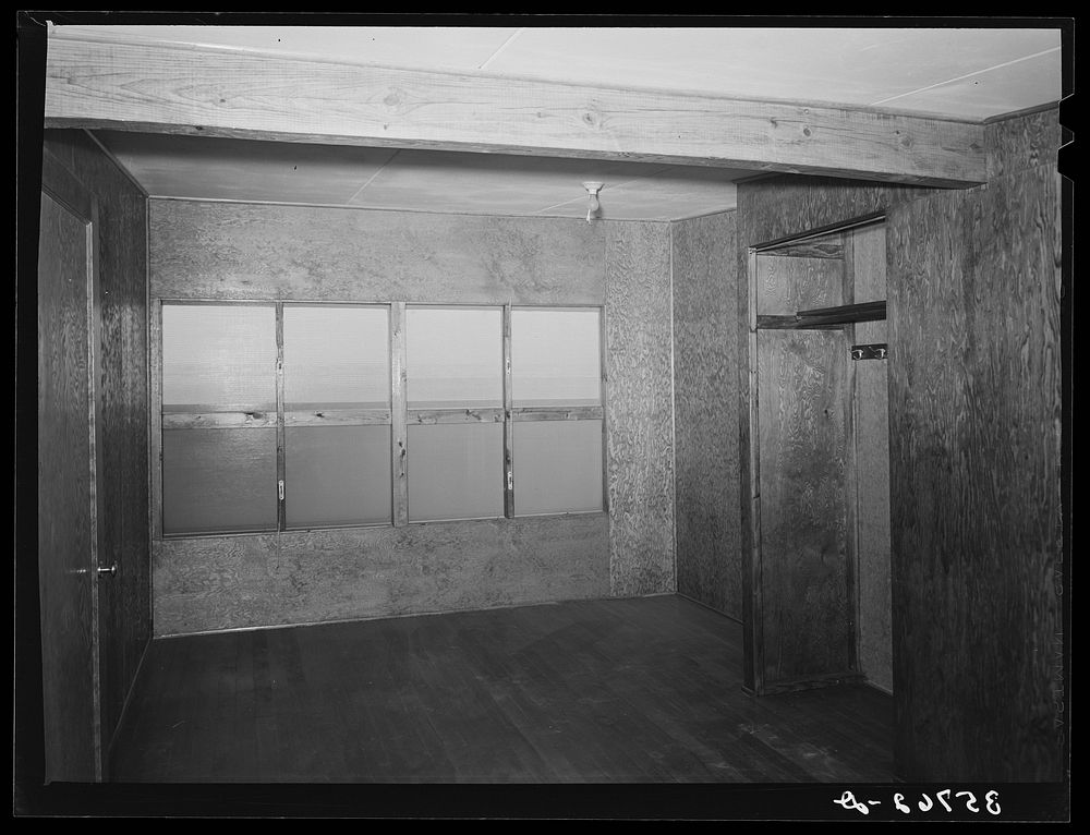 Upstairs bedroom and closet in multi-family unit for permanent agricultural workers at the migratory labor camp. Sinton…