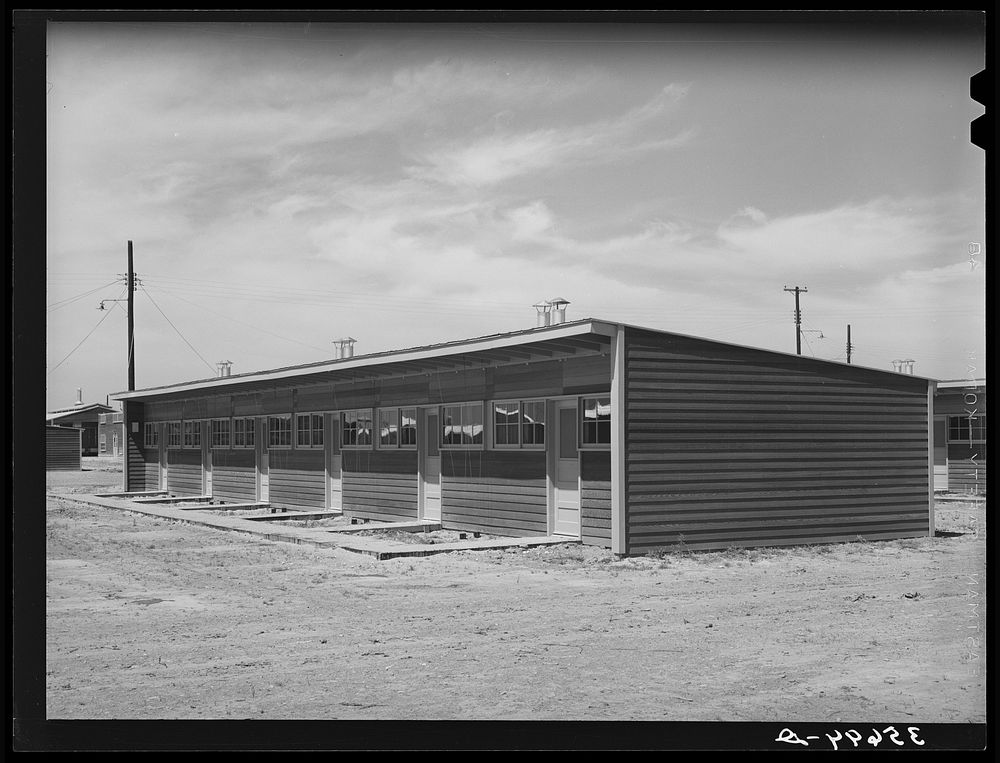 [Untitled photo, possibly related to: Front of row shelter for migratory workers at the migratory labor camp. Sinton, Texas]…