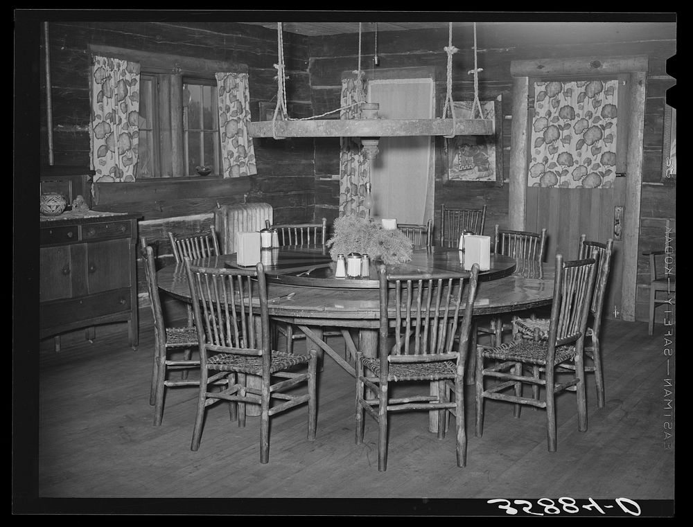 Dining table in Navajo Lodge, Datil, New Mexico. The center of the table which is raised is mounted on an old wagon wheel…