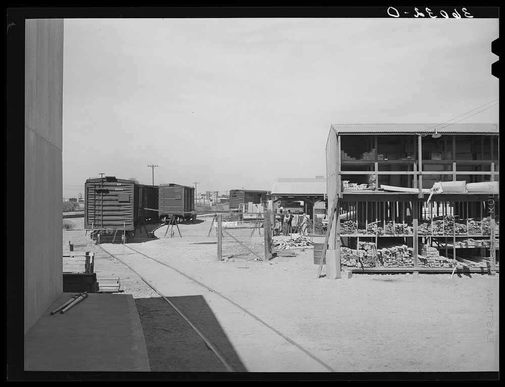 Railroad siding and warehouses of the United Producers and Consumers Cooperative. Phoenix, Arizona by Russell Lee