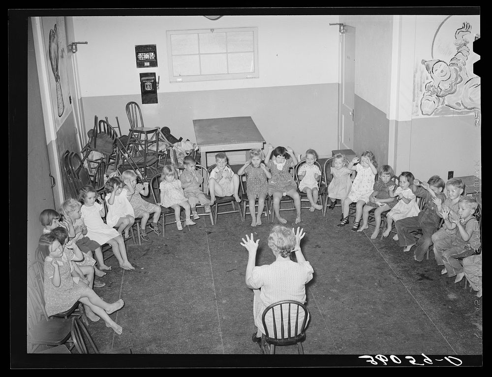 Children of migratory agricultural workers playing games, at the WPA (Work Projects Administration) nursery school at the…