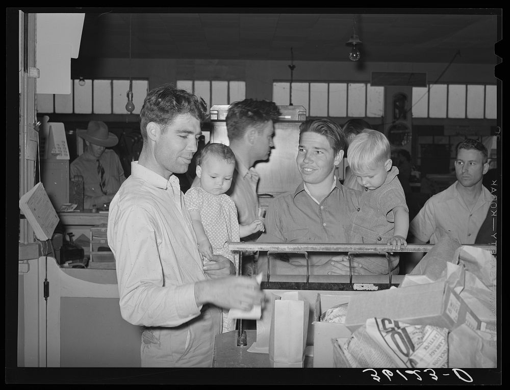 Members and their children at the wrapping desk of the United Producers and Consumers Cooperative. Phoenix, Arizona by…