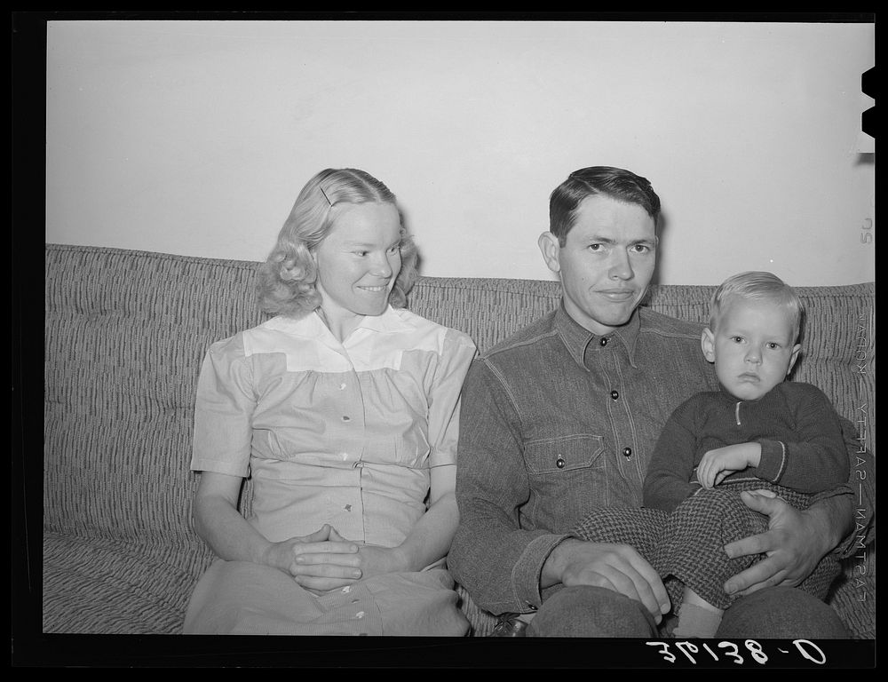 [Untitled photo, possibly related to: Member of the Arizona part-time farms with his wife and child. Maricopa County…