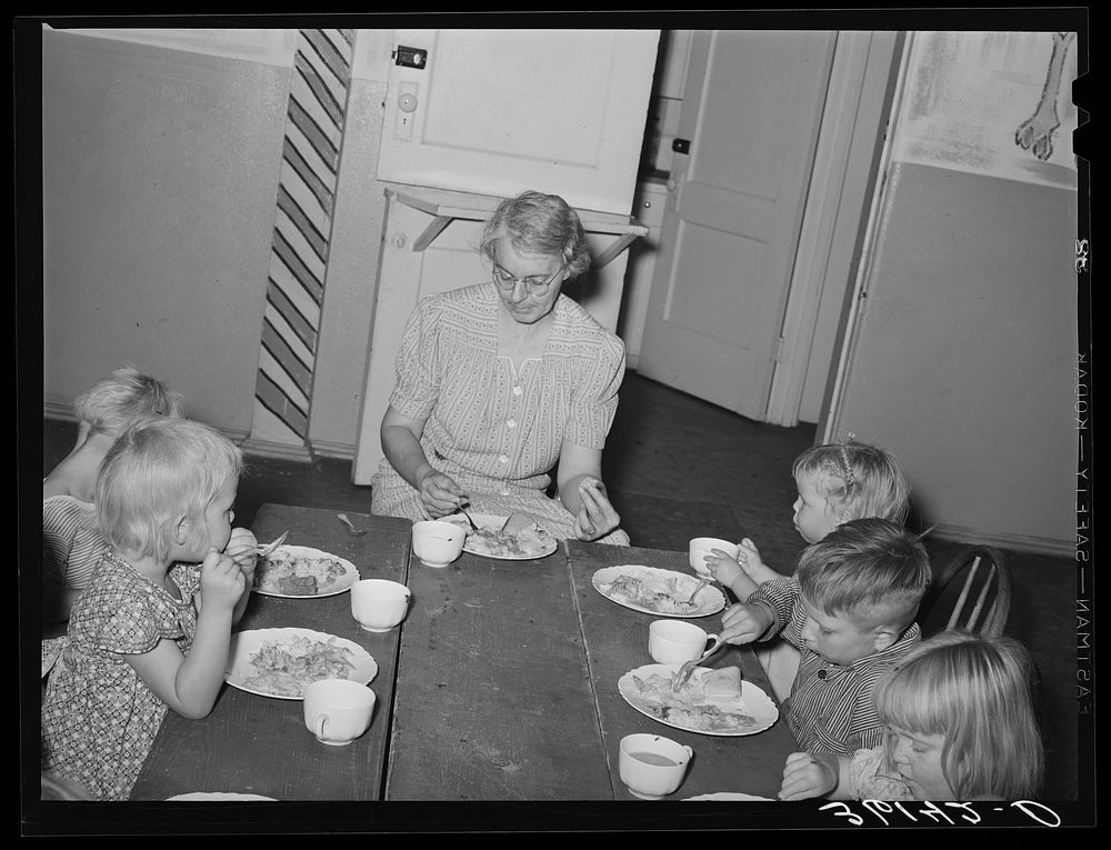[Untitled photo, possibly related to: Children eating lunch at WPA (Work Projects Administration) nursery school at the Agua…