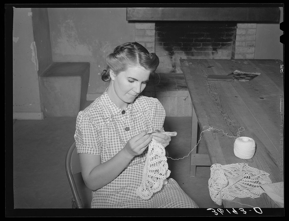 Member of the Arizona part-time farms crocheting in the community building on the project. Maricopa County, Arizona by…