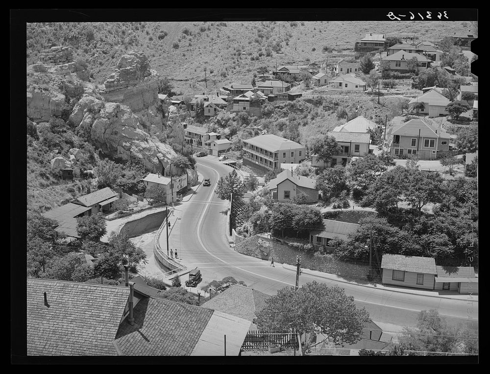 Looking down on the highway leading into Bisbee, Arizona. This highway becomes the main street in town and the houses are…