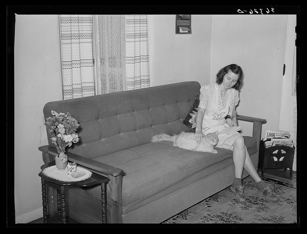 Wife of member of Casa Grande Valley Farms in corner of their living room. Pinal County, Arizona by Russell Lee