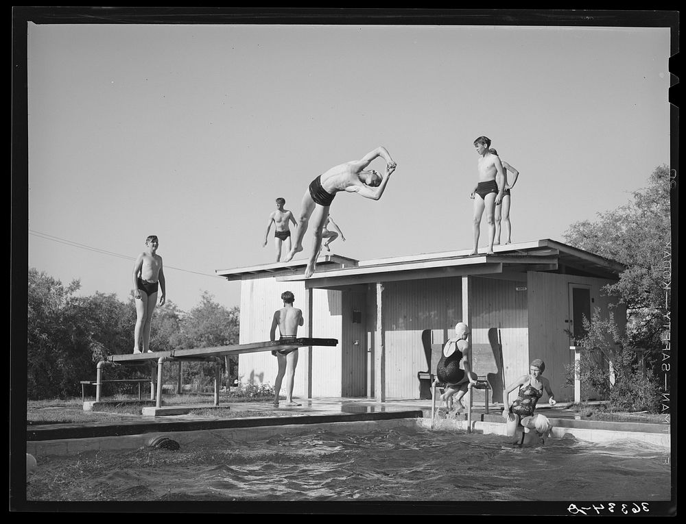 Youngsters in the swimming pool at the dude desert ranch at Coolidge, Arizona by Russell Lee