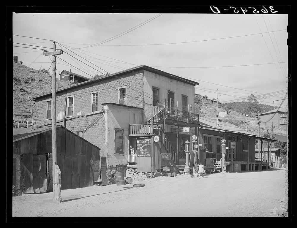 Store and gasoline pumps on main street of Mogollon, New Mexico. Second largest gold mine in the state. The inhabitants of…