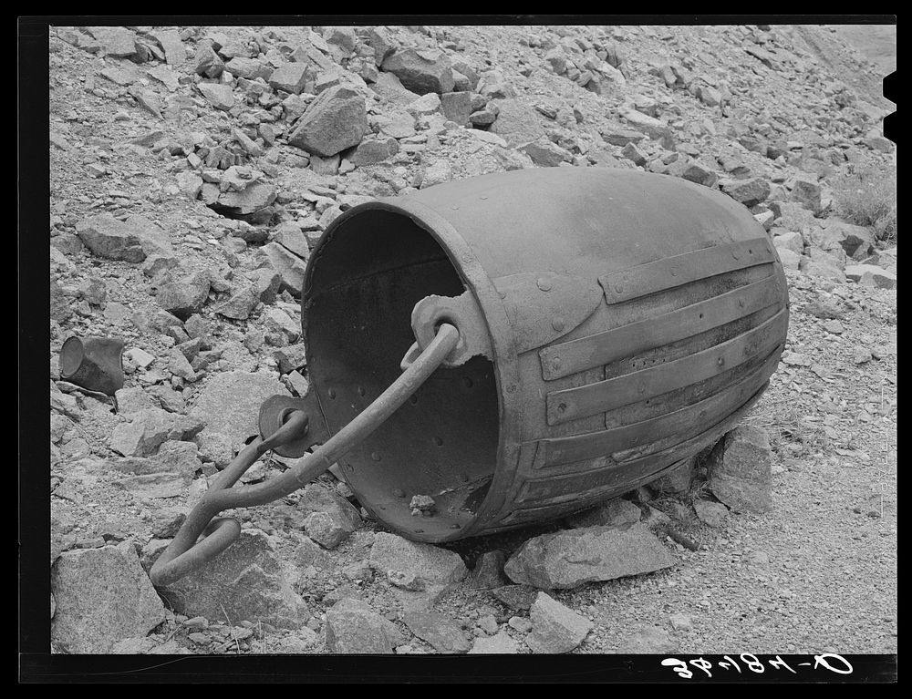 Old gold ore bucket at abandoned mine. Pinos Altos, New Mexico by Russell Lee