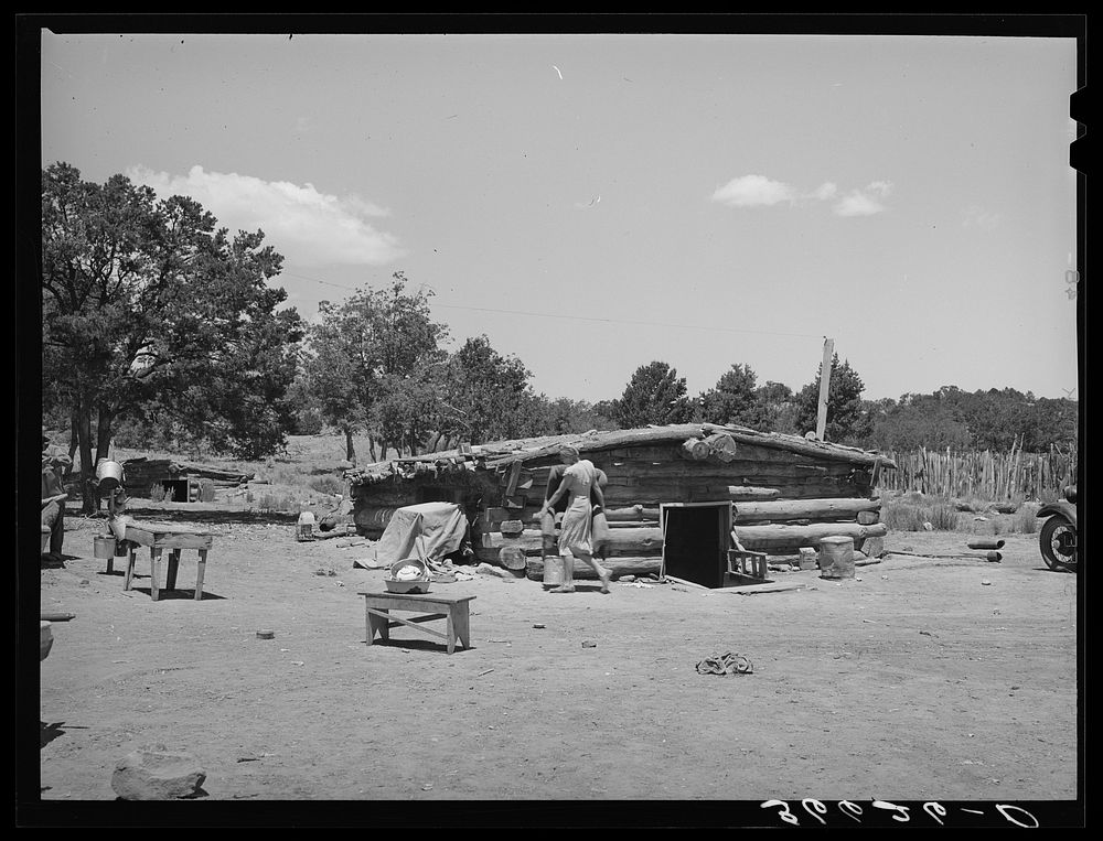 [Untitled photo, possibly related to: Mr. and Mrs. Caudill moving furniture from their dugout. Pie Town, New Mexico] by…