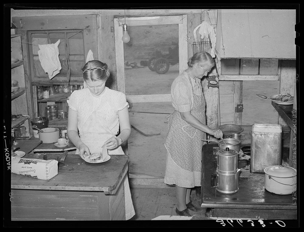 Mother and daughter working in the kitchen of the cafe at Pie Town, New Mexico. The daughter with her husband run the cafe…