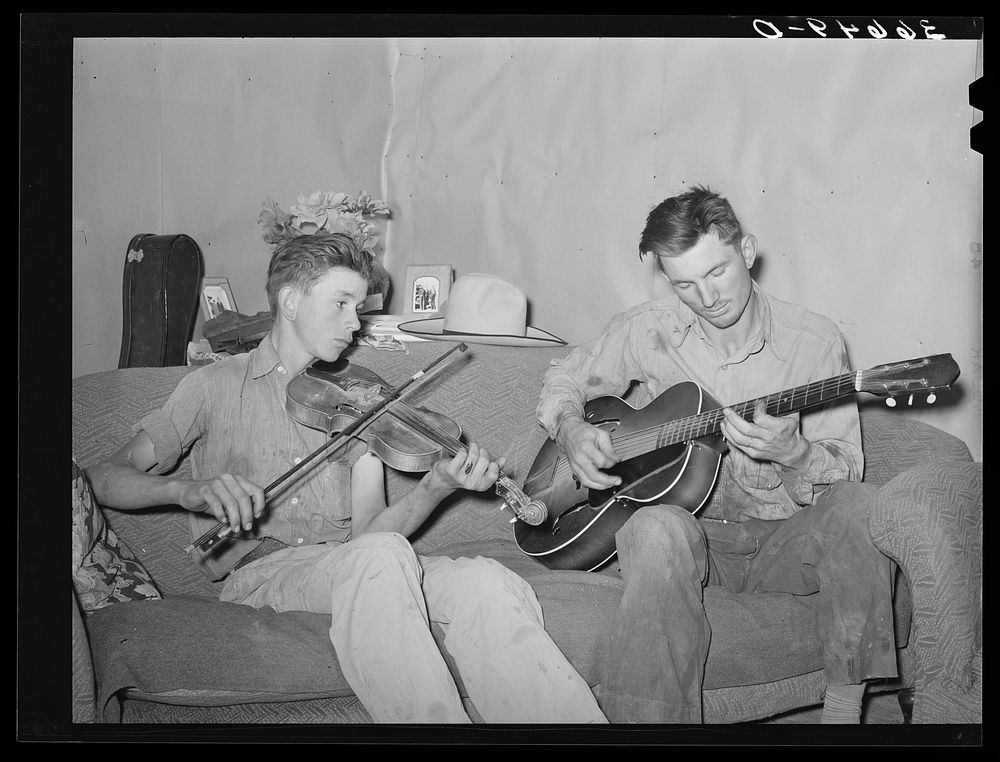 Farmer and his brother making music. Pie Town, New Mexico by Russell Lee