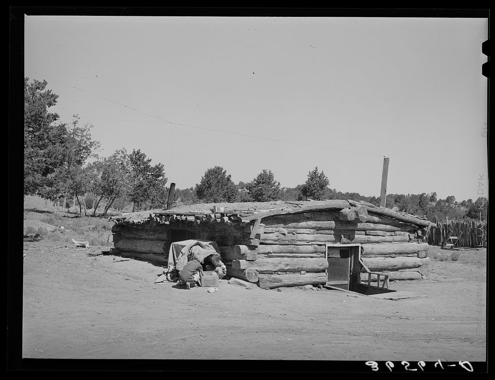 [Untitled photo, possibly related to: Children playing in front of dugout. Pie Town, New Mexico] by Russell Lee