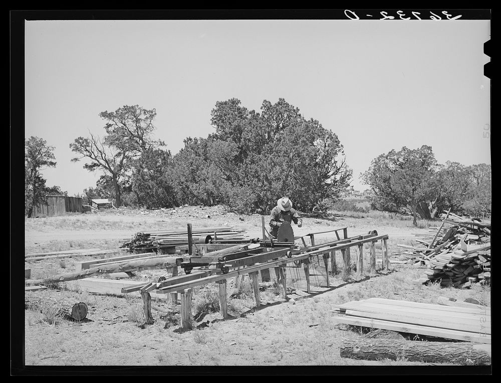 [Untitled photo, possibly related to: George Hutton working at the small sawmill which he built on his homestead farm. This…