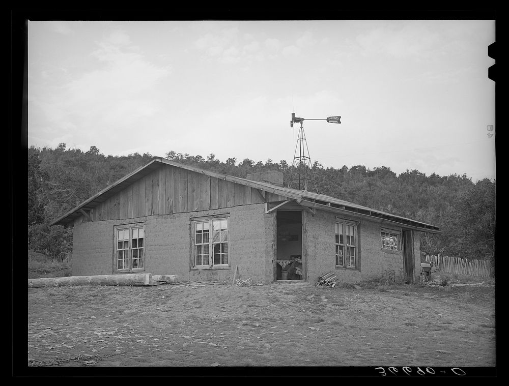 New adobe house of homesteader at Pie Town, New Mexico. This family lived in a one-room log house for seven years by Russell…