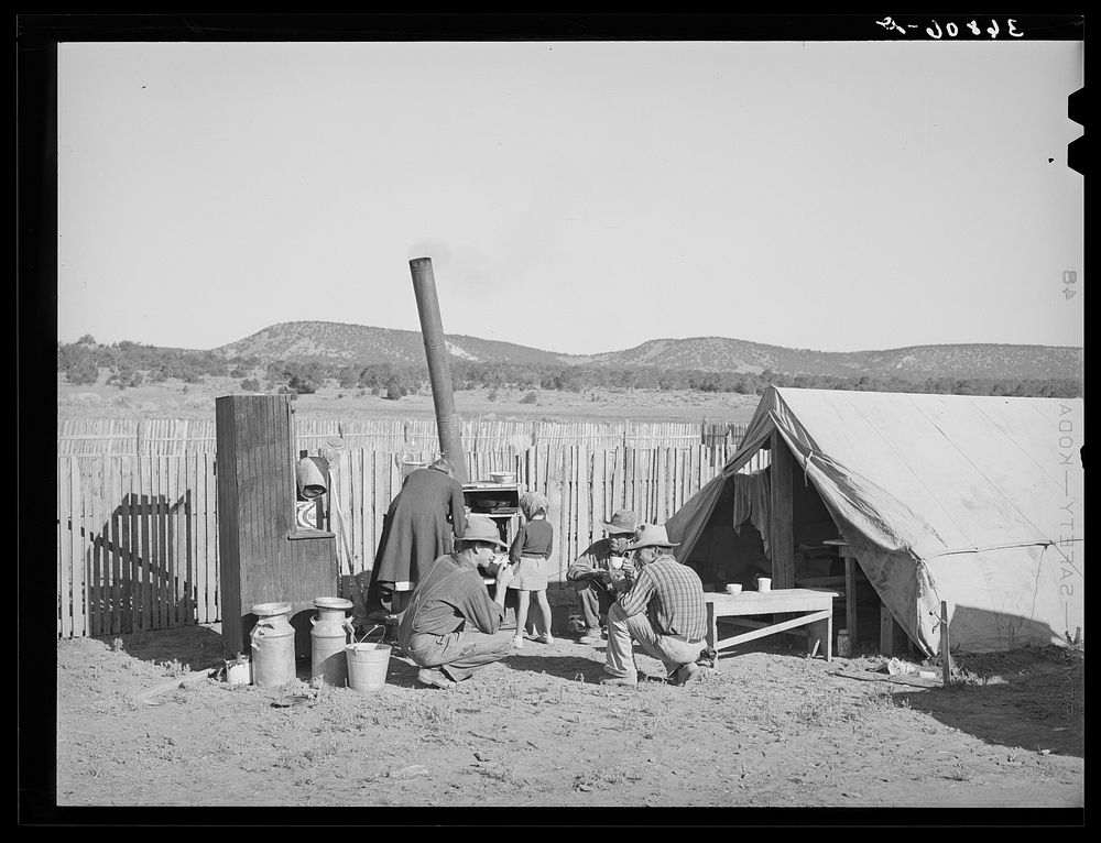 The Caudills are camping out while moving their dugout nearer their water supply, garden and stock lot. These men are…