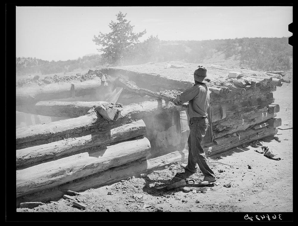 Faro Caudill tearing down his dugout. He is rebuilding his dugout nearer his water. Pie Town, New Mexico by Russell Lee