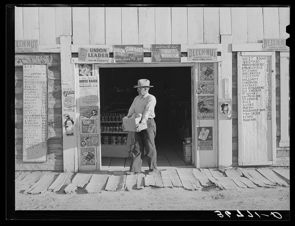 Mr. Keele, merchant and president of the Farm Bureau, in front of the general store. Pie Town, New Mexico by Russell Lee