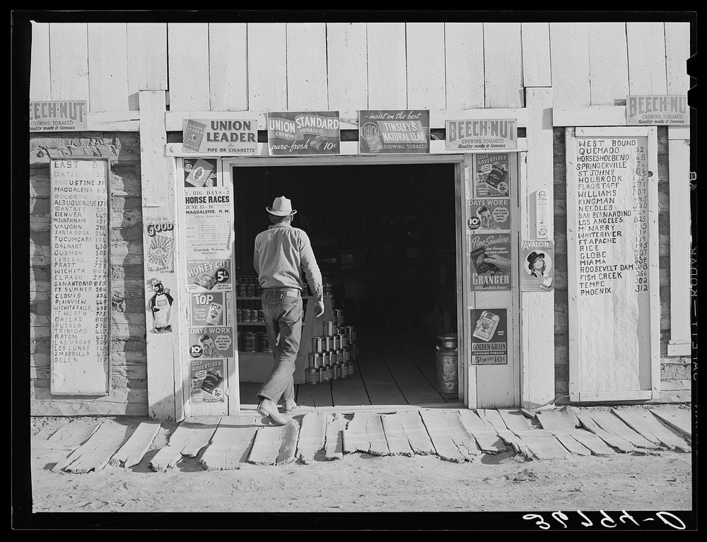 Farmer entering the general store at Pie Town, New Mexico by Russell Lee