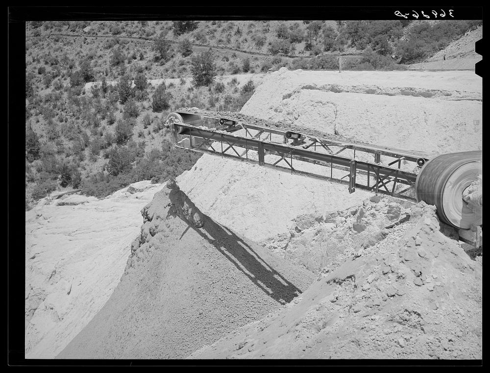 Belt conveyor which drops the tailings onto pile in the valley below. Mill at Mogollon, New Mexico by Russell Lee
