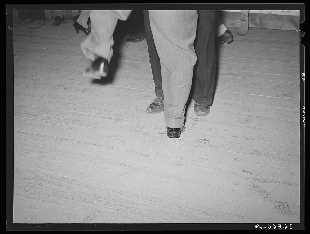 Feet of dancers at square dance. Pie Town, New Mexico by Russell Lee