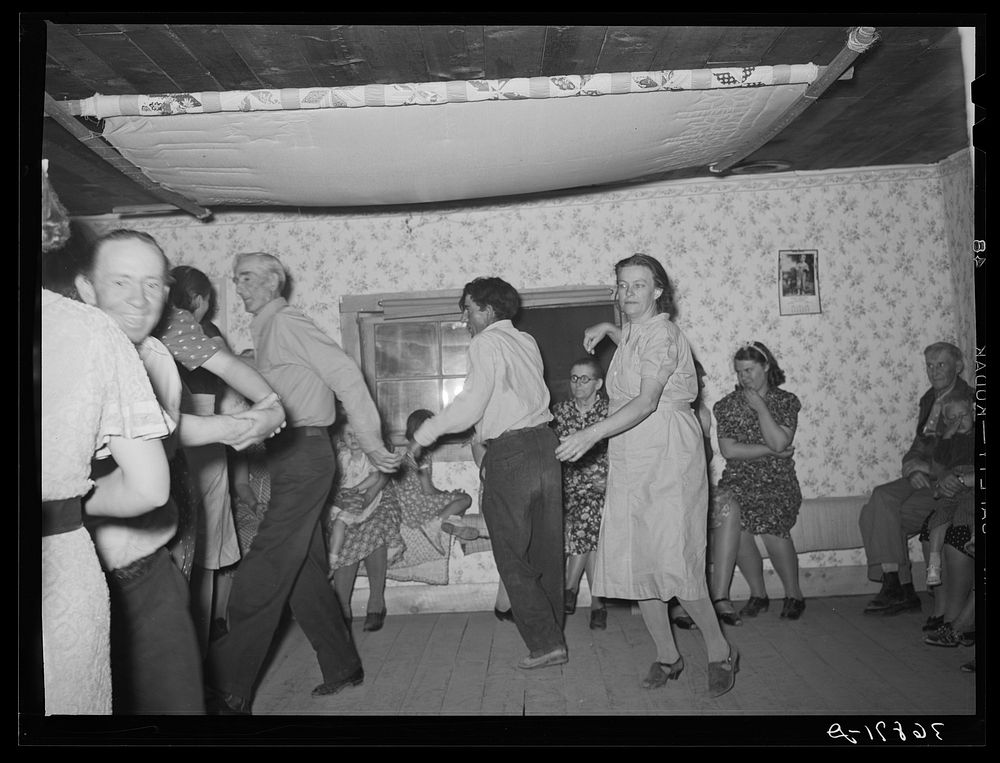 [Untitled photo, possibly related to: The broom dance at the square dance. Pie Town, New Mexico. The extra girl or man…
