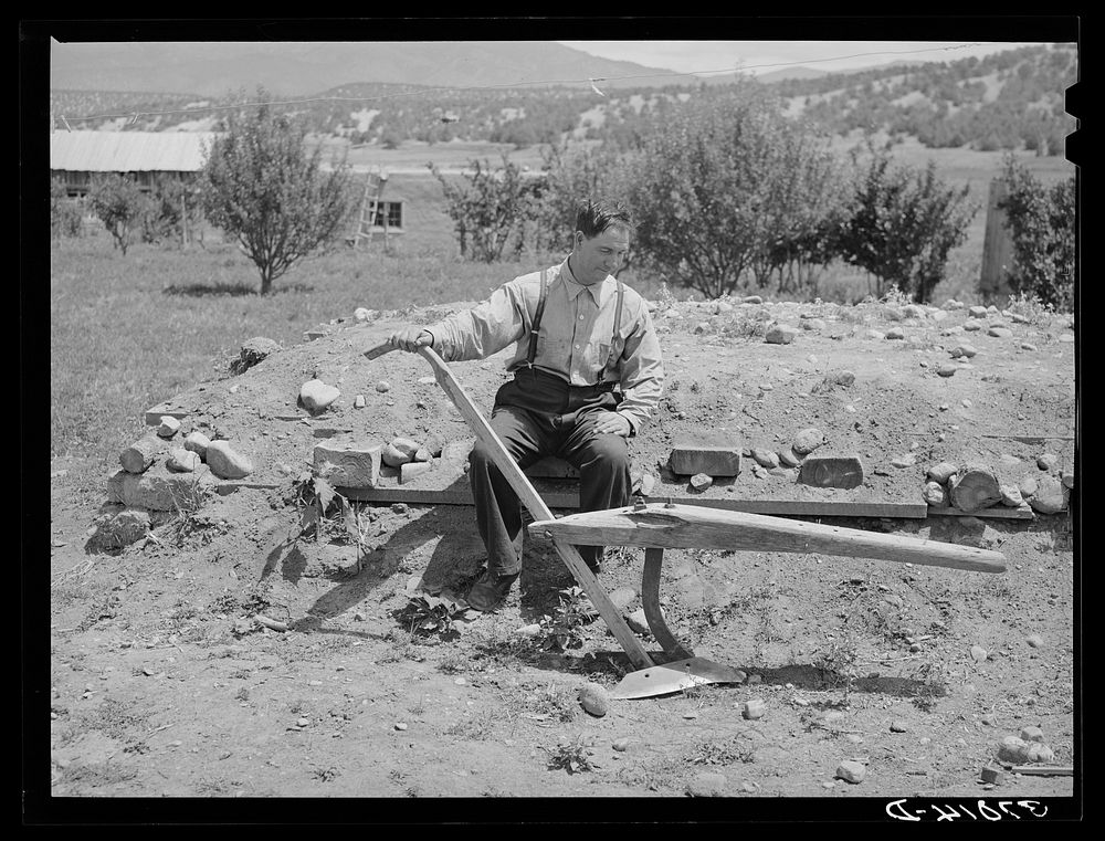 Spanish-American farmer with wooden plow which was used by his father. Chamisal, New Mexico by Russell Lee