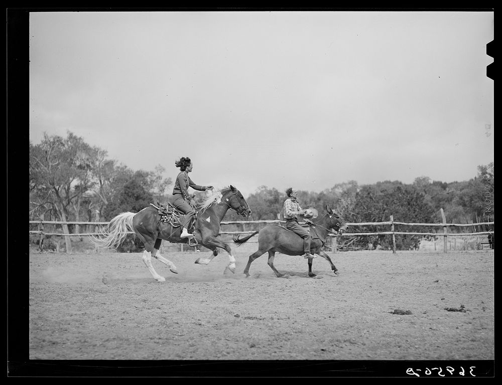 Trick riding at rodeo. Quemado, New Mexico by Russell Lee