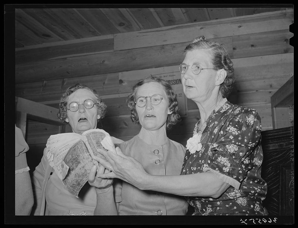 Three members of ladies' quintette at community sing. Pie Town, New Mexico by Russell Lee